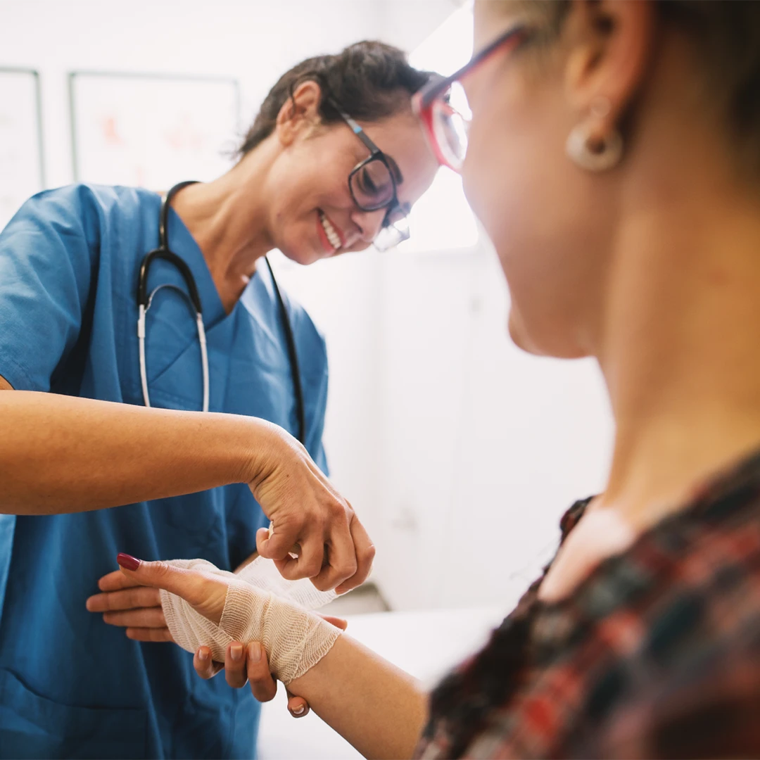 traveling nurse wrapping patient hand image