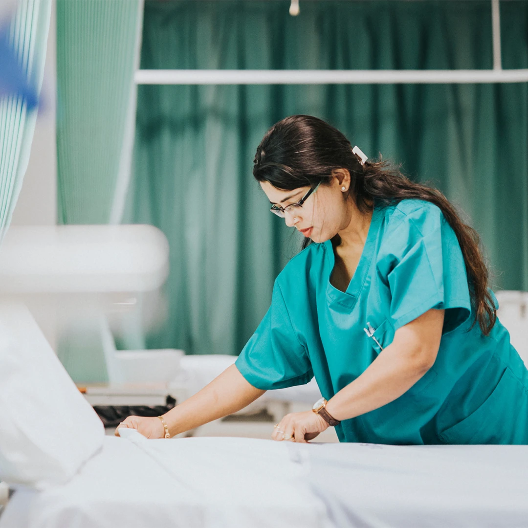 traveling nurse making bed image