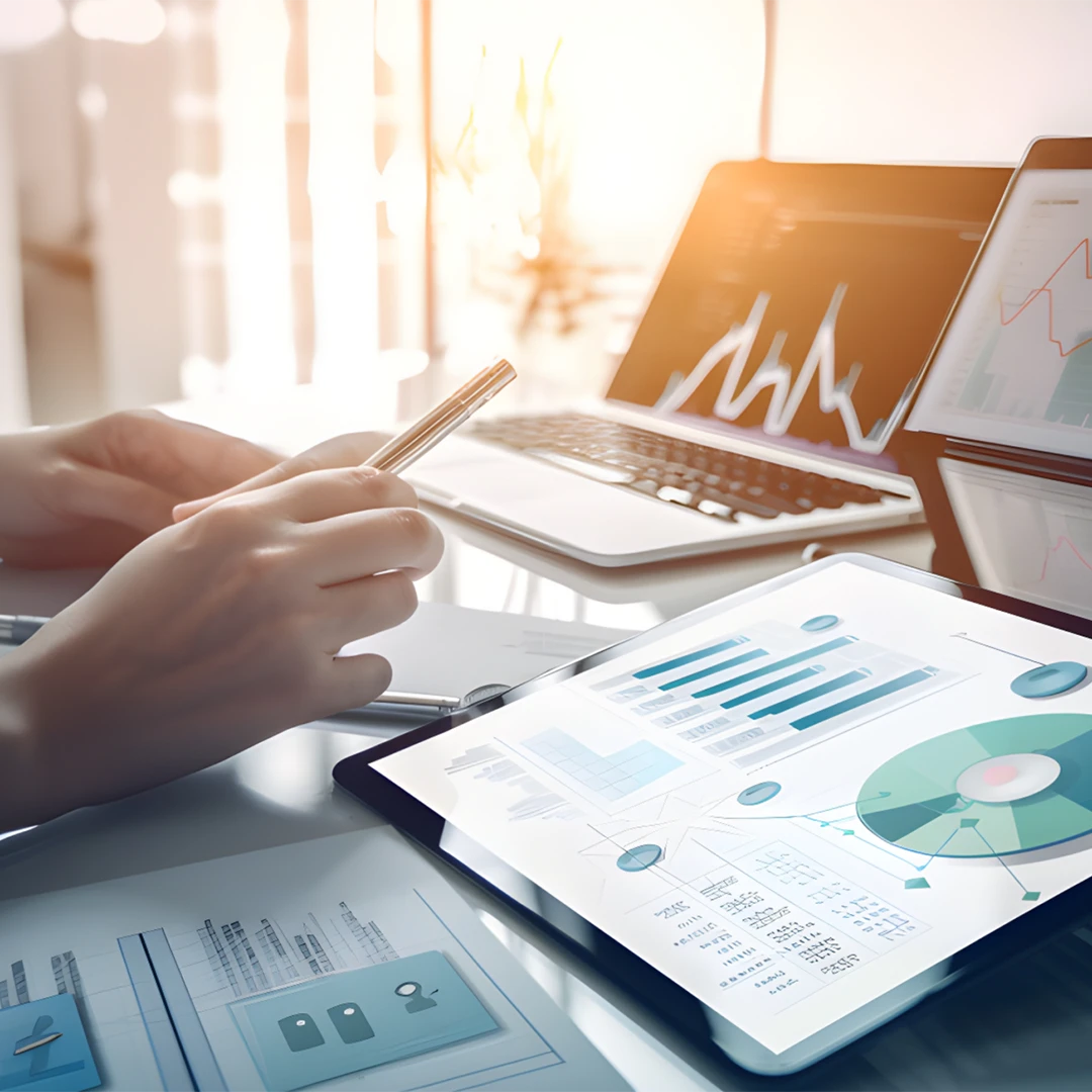 laptop and tablet displaying graphs and data visualization image