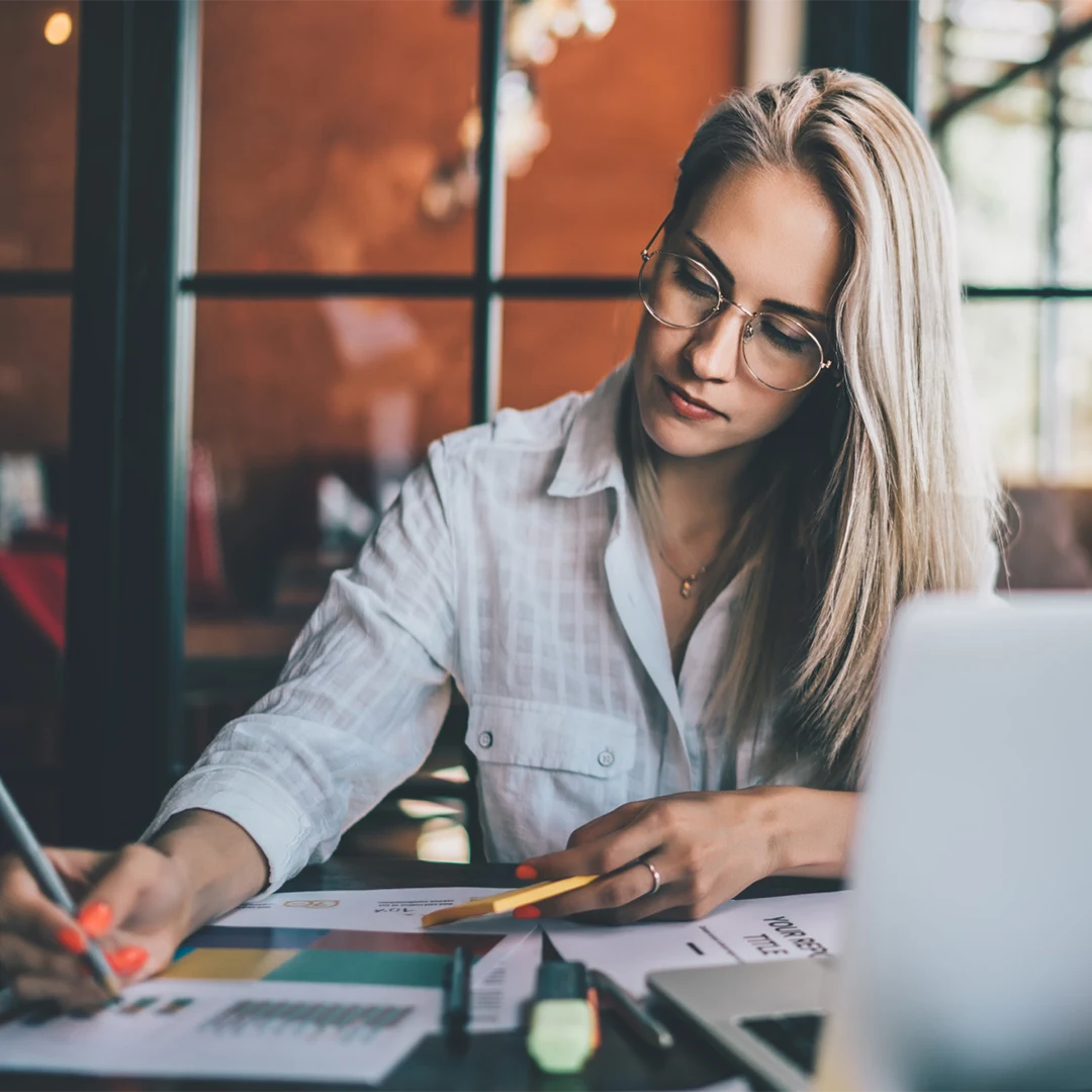 women working analyzing graphs image
